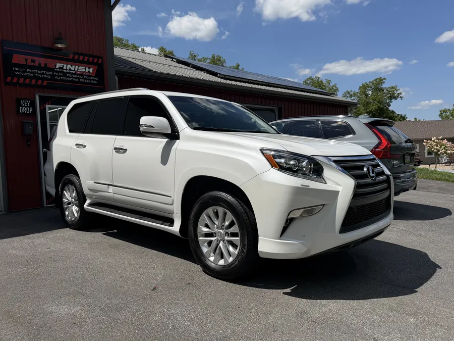 The customer’s white Lexus GX460 outside the Elite Finish shop